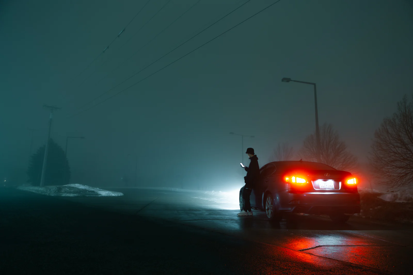 Car stopped on a dark road at night after a drunk driving crash